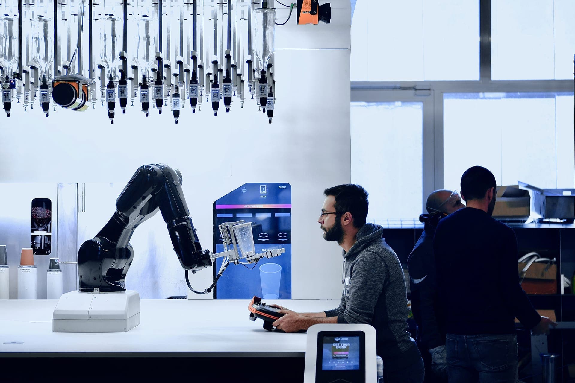 of a tecnichian operating a robot arm